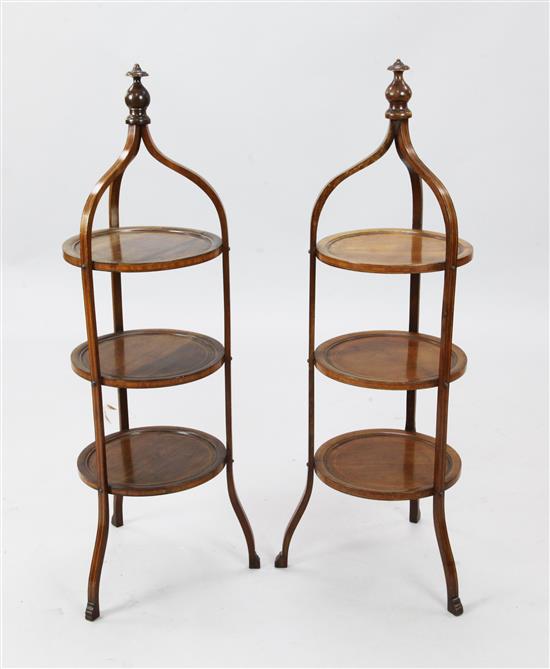 A pair of Edwardian strung mahogany three-tier cake stands, H. 3ft 1in.